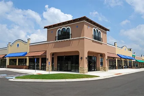 Spanish-style retail plaza with central tower entrance